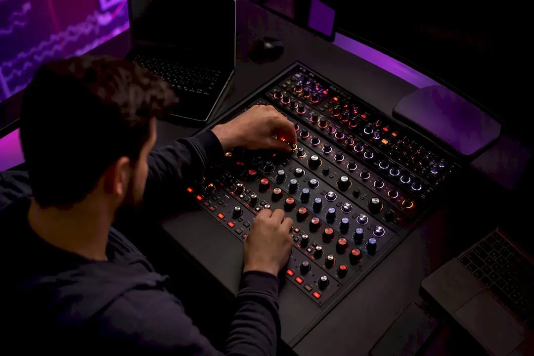 Trader hands adjusting trading dial close-up
