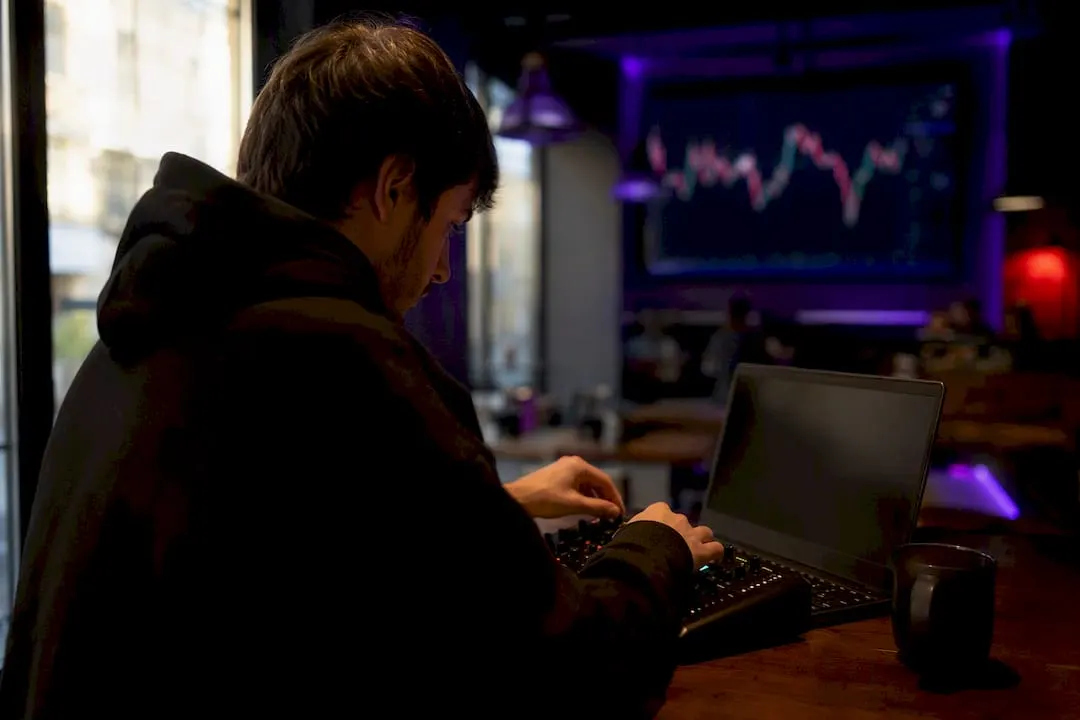 Hands adjusting trading control dial