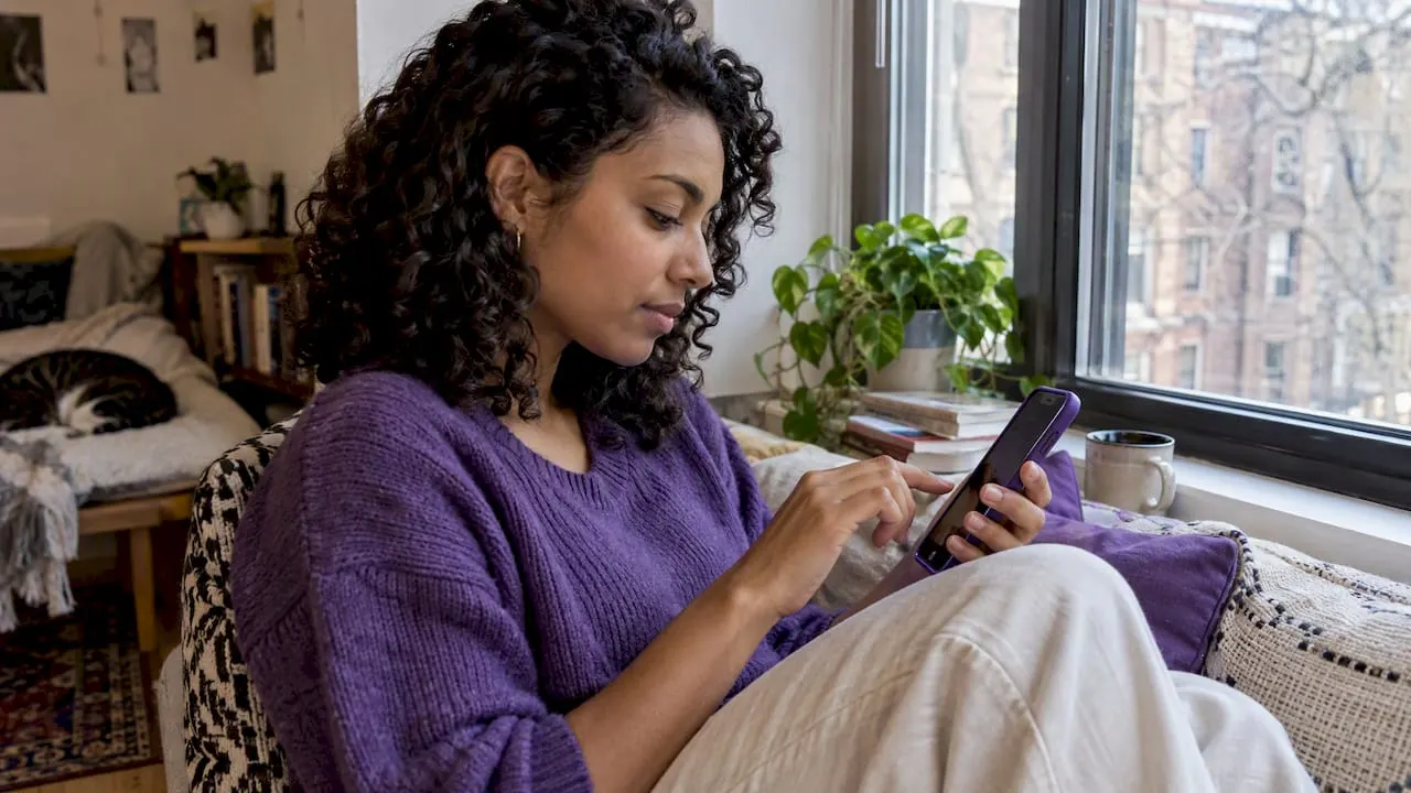 Person comparing social apps on a phone